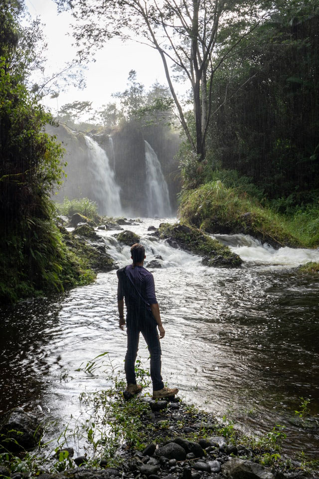 Man by Waterfall